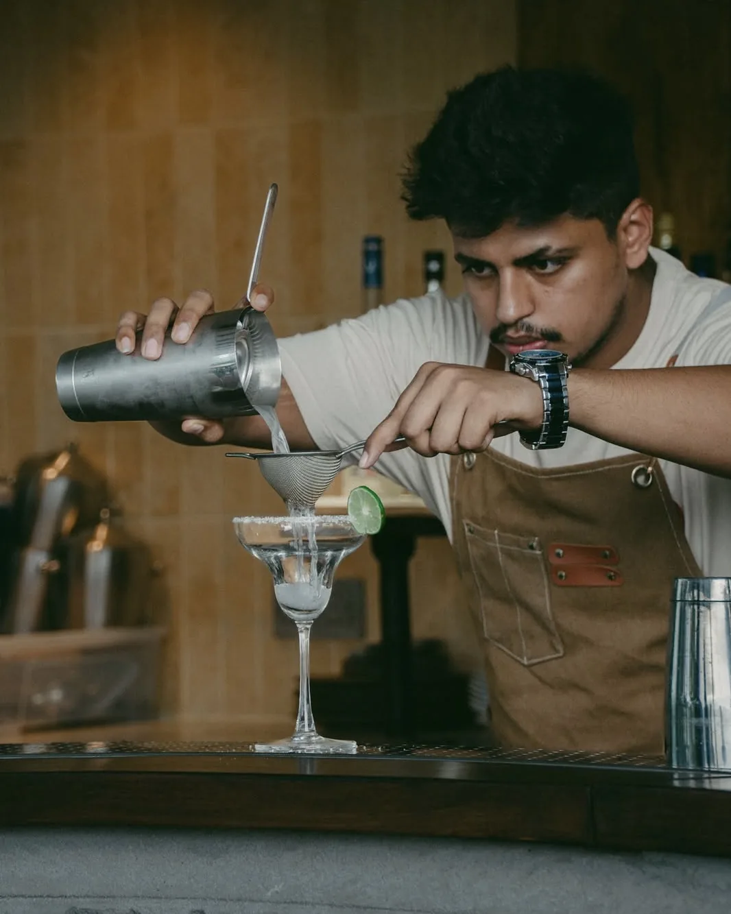 Original Instagram post: the bartender straining a margarita.