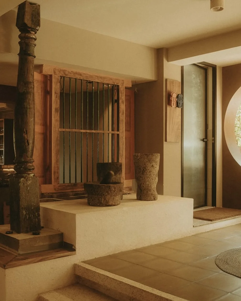 Source image: the lobby with a wooden column.
